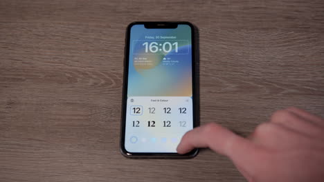 iPhone-with-IOS-customizing-lock-screen-Medium