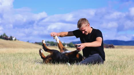 Boy-and-Dog-Playing-in-a-Beautiful-Field