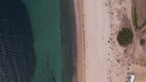 Drone-flight-over-Sardinia-beach-and-coast-Overhead