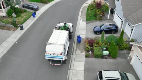 Aerial-shot-of-a-waste-management-truck-picking