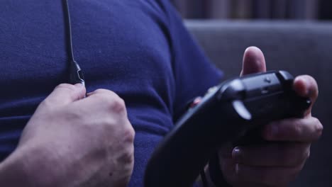 Hands-holding-a-joystick-to-play-video-game