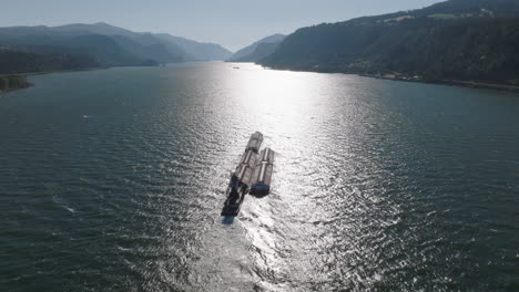 Drone-aerial-of-a-barge-traveling-down-the