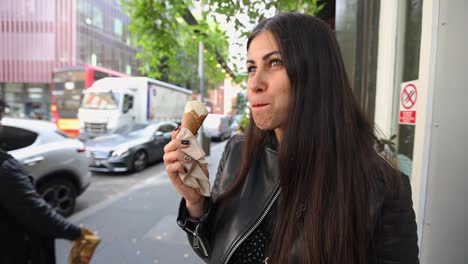 caucasian-long-dark-hair-woman-eating-ice-screen