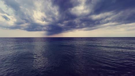 Stormy-sky-and-clouds-over-calm-sea-with