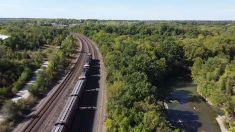 Drone-flying-overhead-following-a-train-going-through
