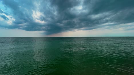 Stormy-sky-and-clouds-over-calm-sea-with