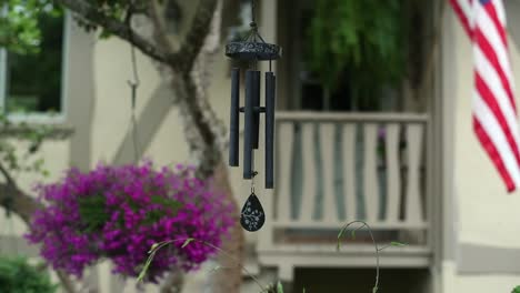 Wind-Chimes-hanging-from-tree-in-front-of