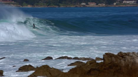 Surfer-celebrating-good-ride-on-big-wave-at