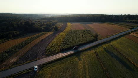 Aerial-view-of-tractor-driving-back-home-farm