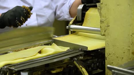 a-woman-works-at-a-pancake-machine