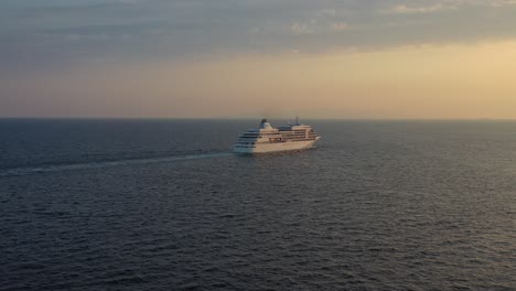 Aerial---Silver-Shadow-cruise-ship-departing-at-sunset