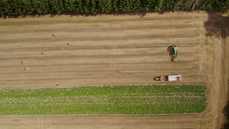 Top-Down-View-Of-Harvesting-Hay-Bales-With