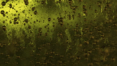 Macro-slowmo-Small-bubbles-rising-in-green-viscous