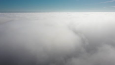 Descending-in-clouds-dive-in-low-sunlight-above