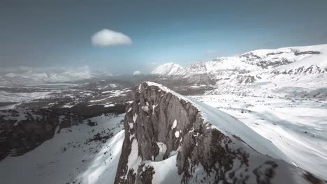 Low-cinematic-FPV-shot-above-the-summit-of