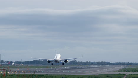 Passenger-aeroplane-touchdown-at-Barcelona-airport-runway-Spain