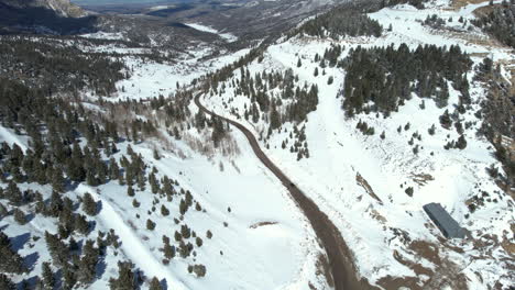 Aerial-View-of-Dark-Vehicle-on-Mountain-Pass