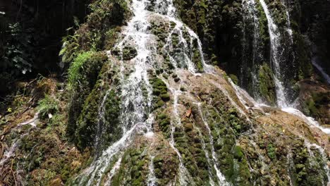 Camera-flying-over-a-waterfall-in-Kupang-East
