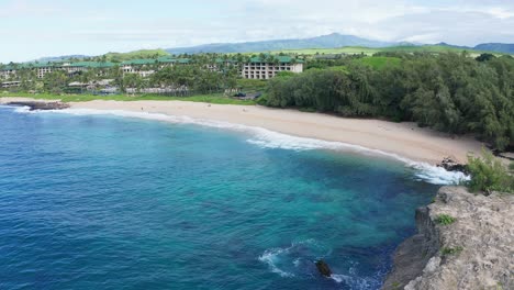 Aerial-Shot-of-Poipu-area-beach-flying-over