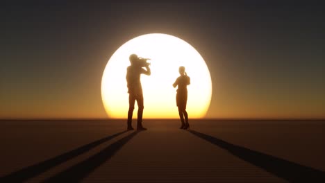 Cameraman-and-reporter-silhouettes-on-large-sunset-standing
