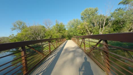 Bike-ride-on-bridge-over-river-gravel-path