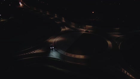 Aerial-view-of-a-lighted-roundabout-at-night