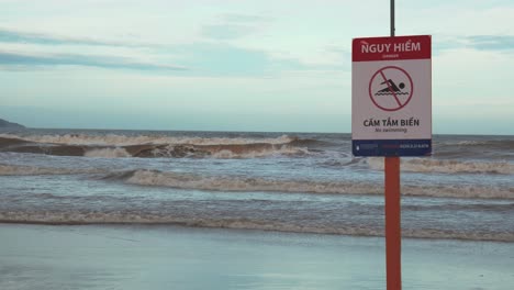 No-Swimming-Red-Warning-Sign-on-Beach-in