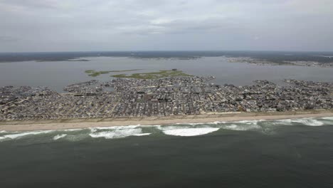 Aerial-view-overlooking-the-coastline-of-Lavallette-cloudy