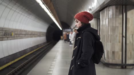 Girl-waiting-for-metro-or-subway-in-Prague
