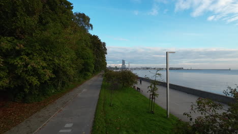 Aerial-Flying-Over-Esplanade-Walkway-Path-With-Trees-In-Seaside-Boulevard-Of-Gdynia