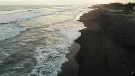 Waves-Washing-Over-Black-Sand-Beach-Of-El-Paredon-In-Guatemala
