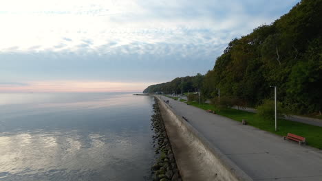 Aerial-Flying-Over-Breakwater-With-Calm-Waters-In-Seaside-Boulevard-Of-Gdynia