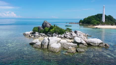 aerial-of-rocky-islet-on-coast-of-lengkuas-island-in-belitung-on-sunny-summer-day
