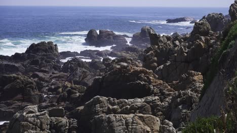 Ocean-Waves-Crashing-Against-Rocks-At-Summer