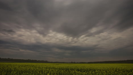 Dark-stormy-clouds-moving-over-spring-field