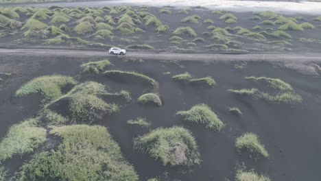 Car-Driving-On-Stokksnes-With-Grassy-Hill-To-The-Beach-In-Iceland