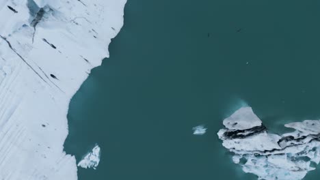 Icebergs-In-Blue-Waters-Of-Jokulsarlon-Glacial-Lagoon-In-Iceland