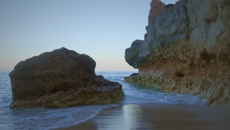 Calming-waves-wash-around-beautiful-sandstone-rocks-in-an-idyllic-paradise-setting