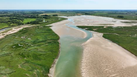 -Het-Zwin-nature-reserve,-a-wetland-and-estuary-at-the-North-Sea-in-Europe,-drone-view