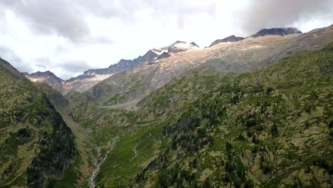 Aerial-Flying-Over-Benasque-Valley-With-Aneto-Peak-In-The-Distant-Background
