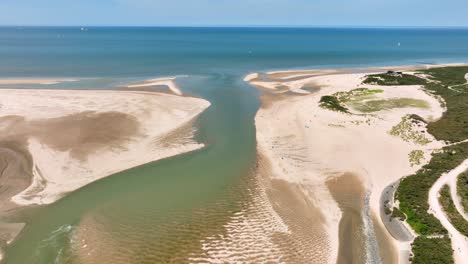 River-flowing-into-the-North-Sea-at-Netherlands-and-Belgium-border,-Het-Zwin-nature-reserve