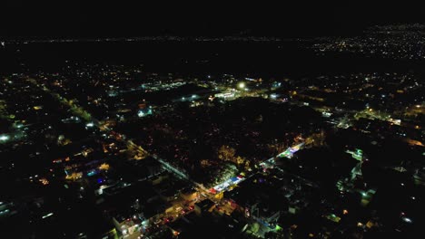 Flying-around-a-graveyard-at-All-hallows-eve-illuminated-with-candle-lights---Aerial-view