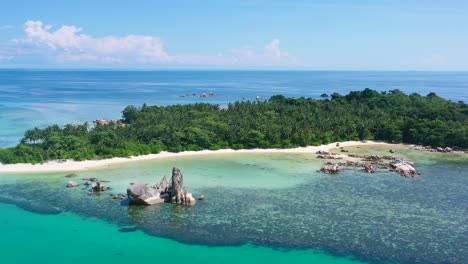 aerial-of-rocky-coastline-on-remote-tropical-island-in-turquoise-water-at-belitung-indonesia