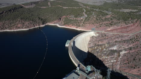 Aerial-View,-Hydroelectric-Dam,-Power-Plant-and-Road-Passing-by-Water-Reservoir
