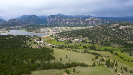 View-From-Above-The-Countryside-Green-Landscape-With-Background-Of-Rocky-Mountains-In-Denver,-Colorado,-USA
