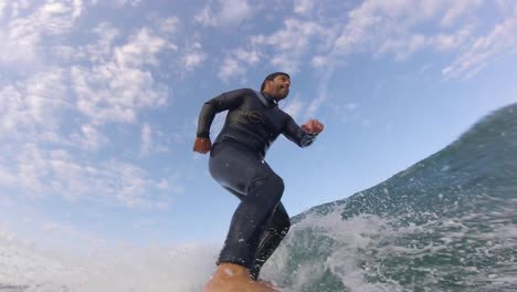 Surfer-on-blue-ocean-wave-getting-epic-barrel,-Surfing-extreme-sport,-4k