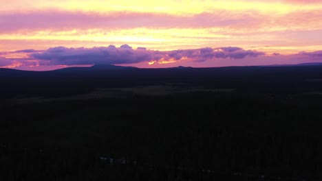 Colorful-purple-pink-sunset-over-mountains-in-Kiimaselkä,-Finland