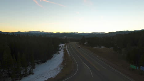 Ascending-Drone-footage-of-roadway-in-Central-City-Colorado-at-sunset