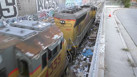 large-train-rolls-through-city