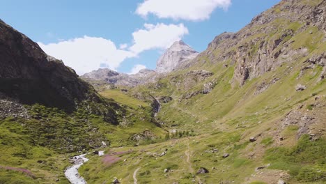 Italian-alps-valley,-aerial-drone-view-with-motion-to-the-left